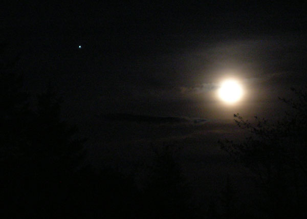 Got a nice shot of the moon last night - eerie clouds, and a bright star 